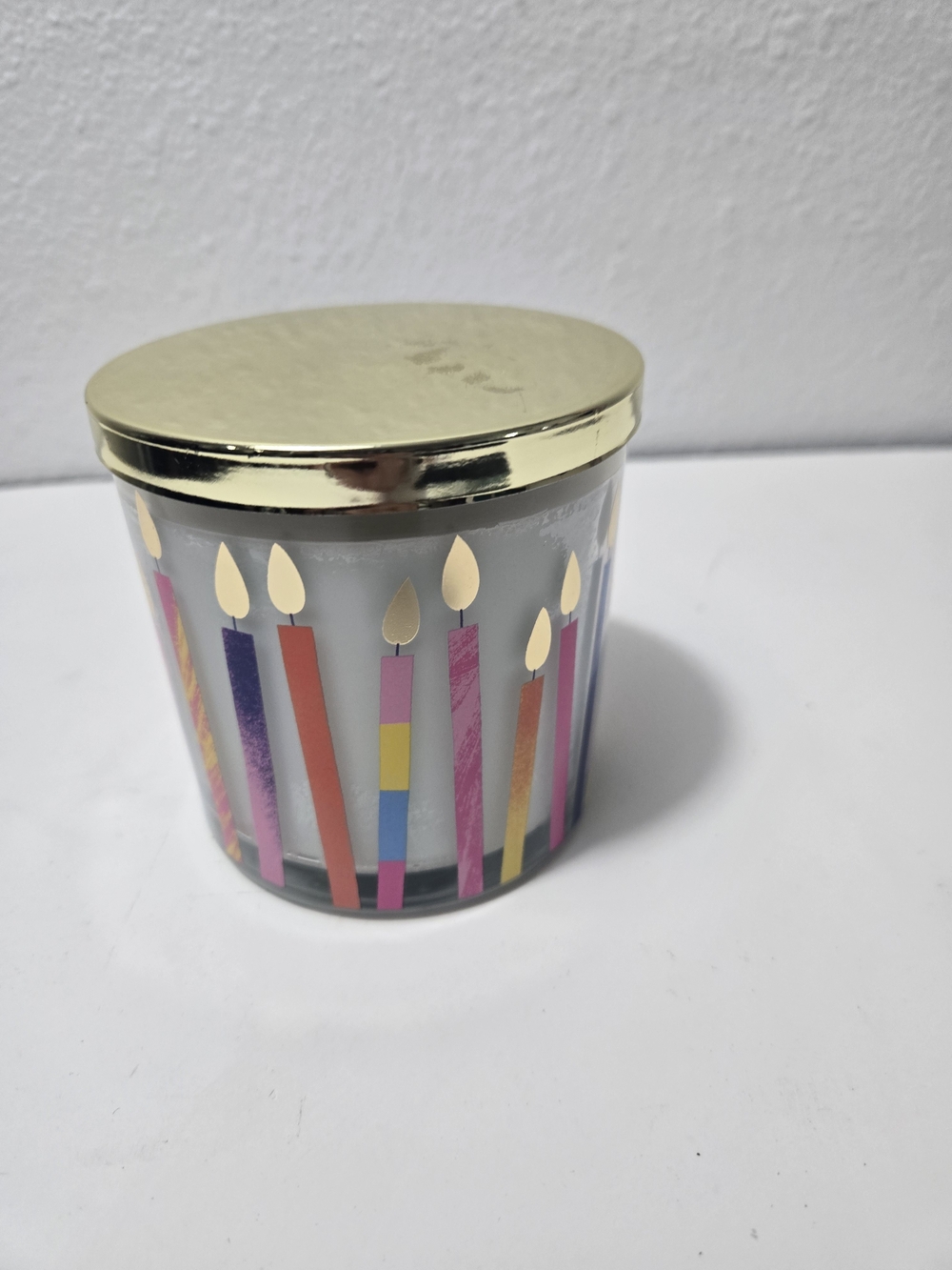 Sonoma Gold-Lid Celebration Candle Jar with Colorful Candle Motif